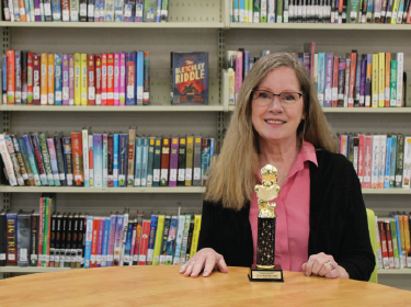 librarian with trophy
